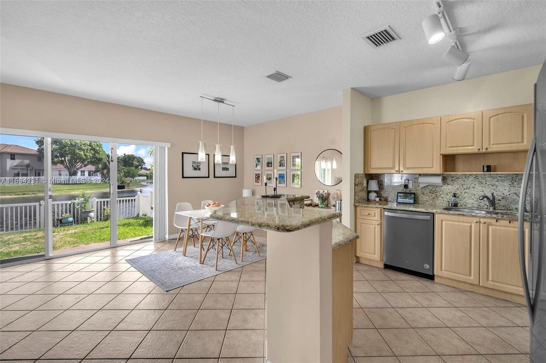 Partial kitchen and dining area with views of the lake.