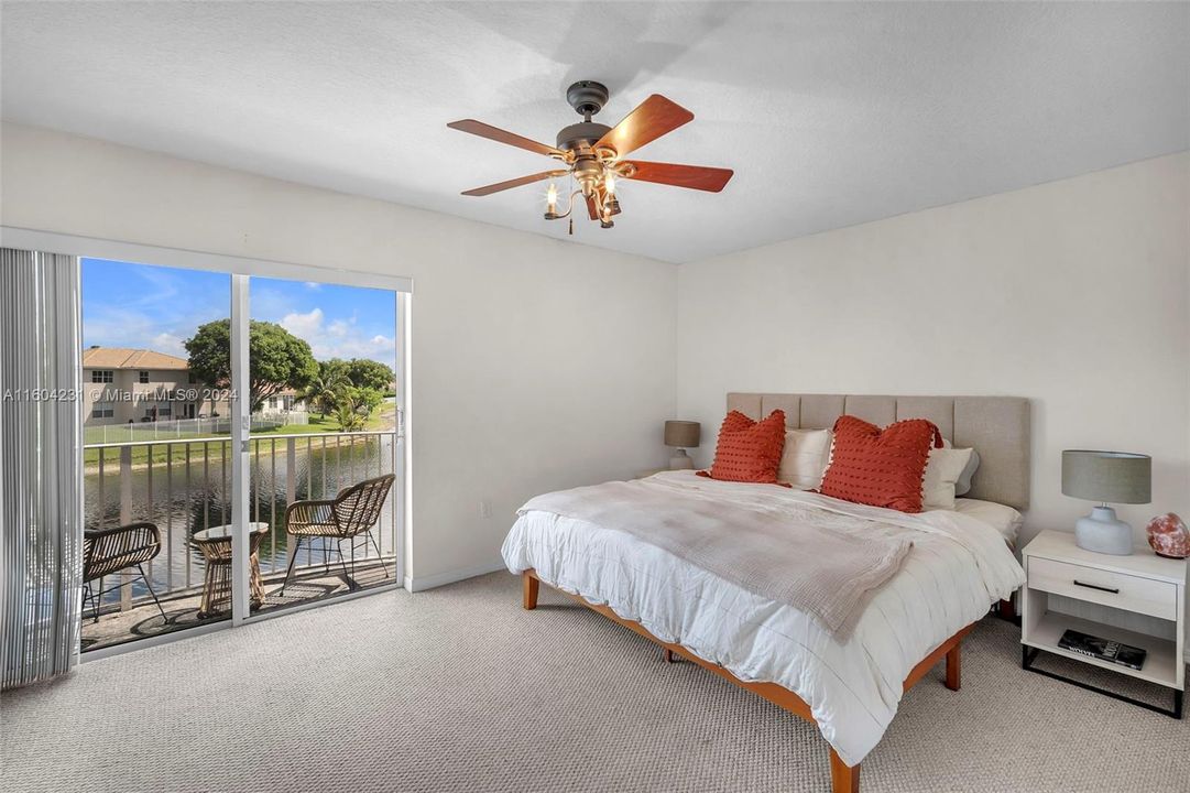 Nice size primary bedroom with lake views.