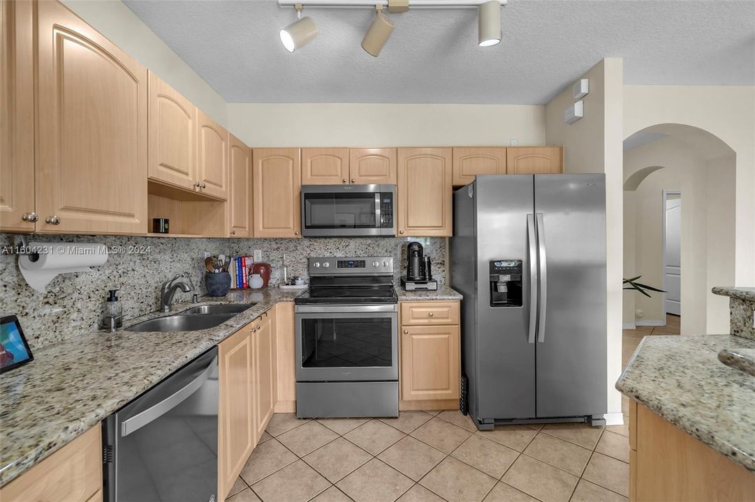 Kitchen with updated Stainless-Steel appliances.