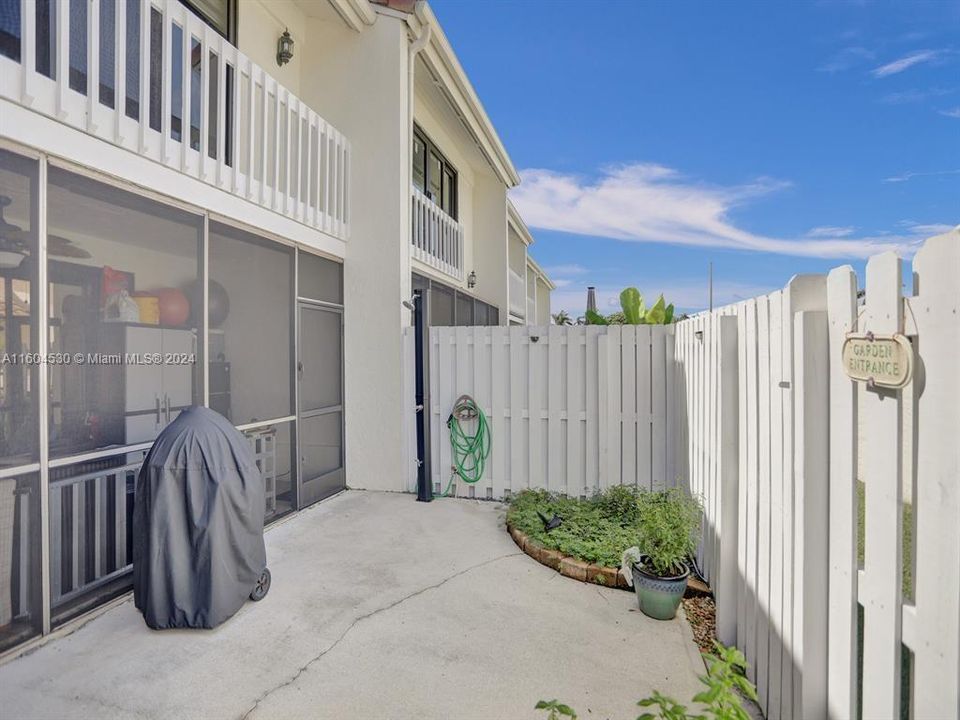 There is a backyard space just outside of the screened patio!