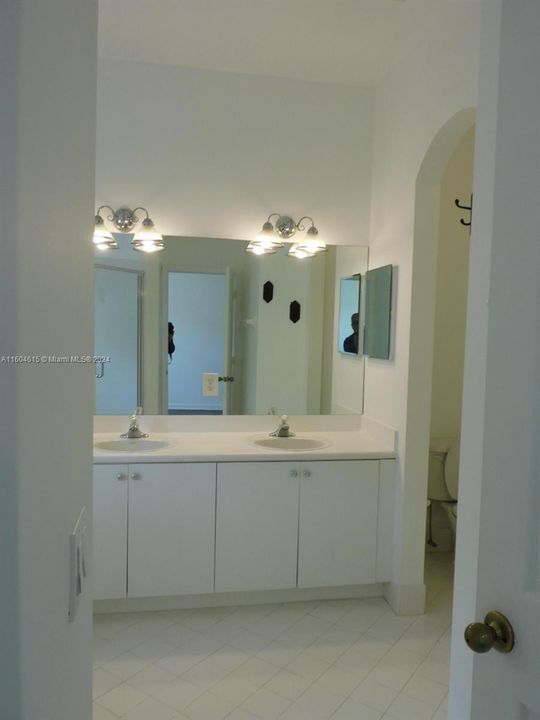 Primary Bedroom ensuite with dual vanities.