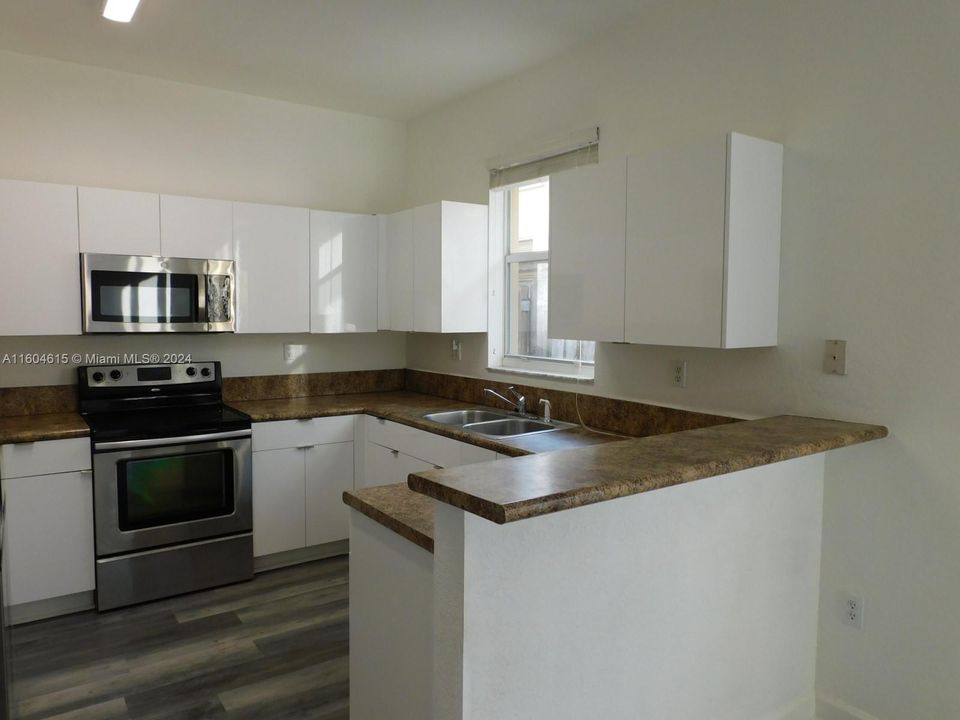 Kitchen with breakfast counter.