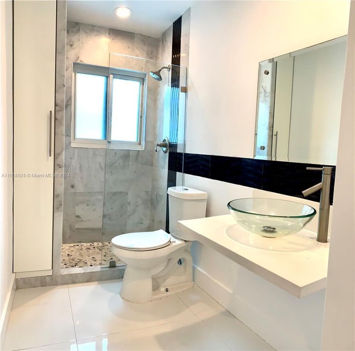 Second Bathroom with nice mosaic and glass shower door