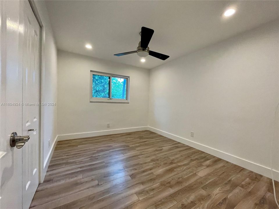 Spacious 3rd Bedroom with wall closet, ceiling fan and LED lights.