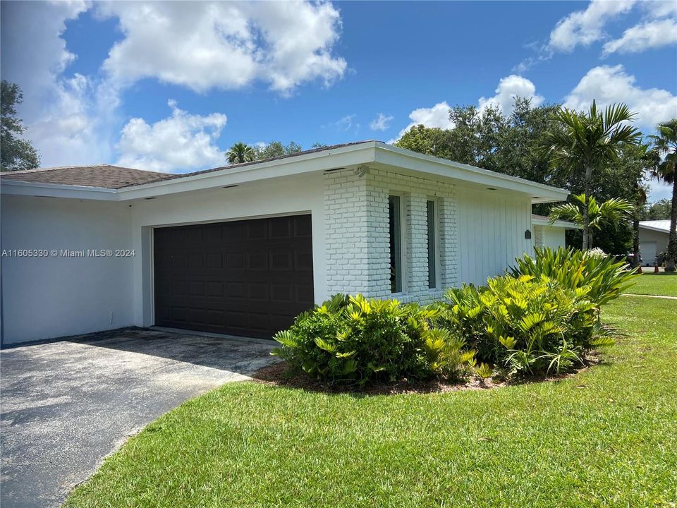 Side entry garage with impact door