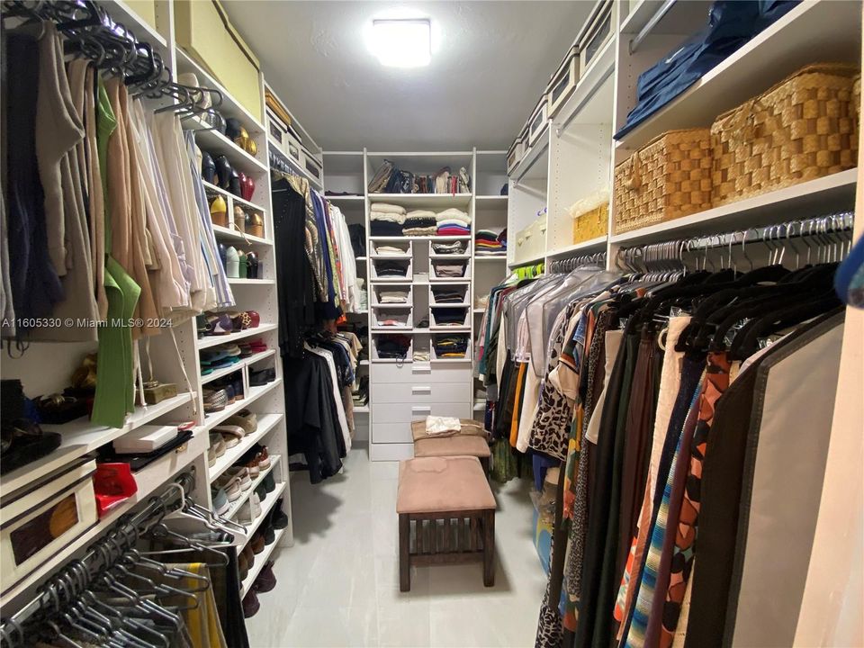 Master walk in closet with California Closet shelving. There’s also another closet in the master His and Hers.