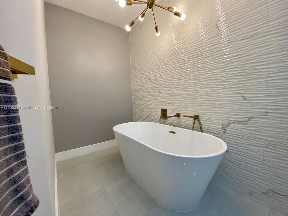 Luxurious master bathroom with freestanding soaking tub