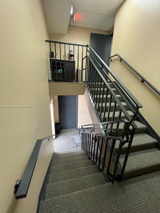 stairs to/from 2nd floor office out the space