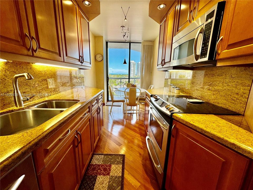 NEW CUSTOM DESIGNER SOLID CHERRY WOOD & CORSICAN GRANITE KITCHEN WITH CUSTOM BACKLIT AND CEILING "LED" LIGHTING