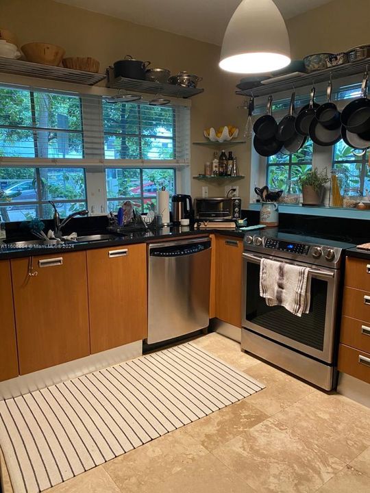 Dining area + bar with stools in the kitchen