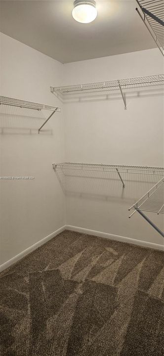 Walk in master bedroom closet