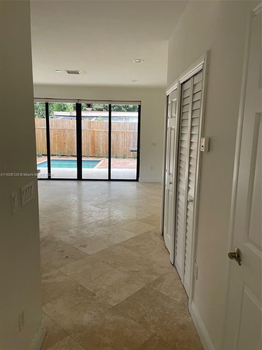 hallway to living room and kitchen