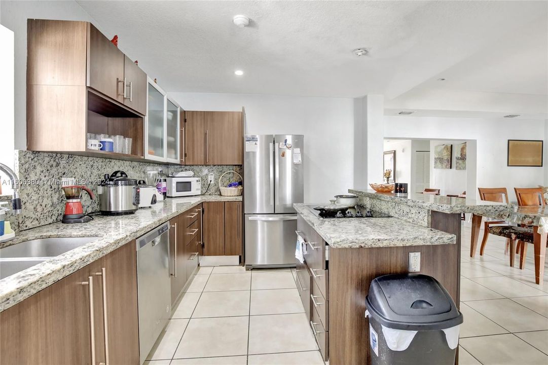 Modern clean line cabinets with plenty of countertop space for prepping and stainless-steel appliances.