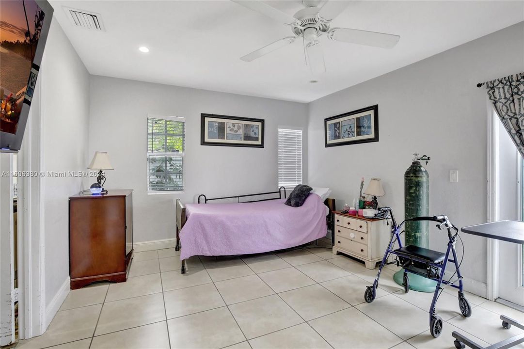 And... this is the sizable master bedroom with its ensuite, walk-in closet, and French door that opens to the patio. It was added to the original house structure (as well as the kitchen, dining room and terrace...all done with permits.