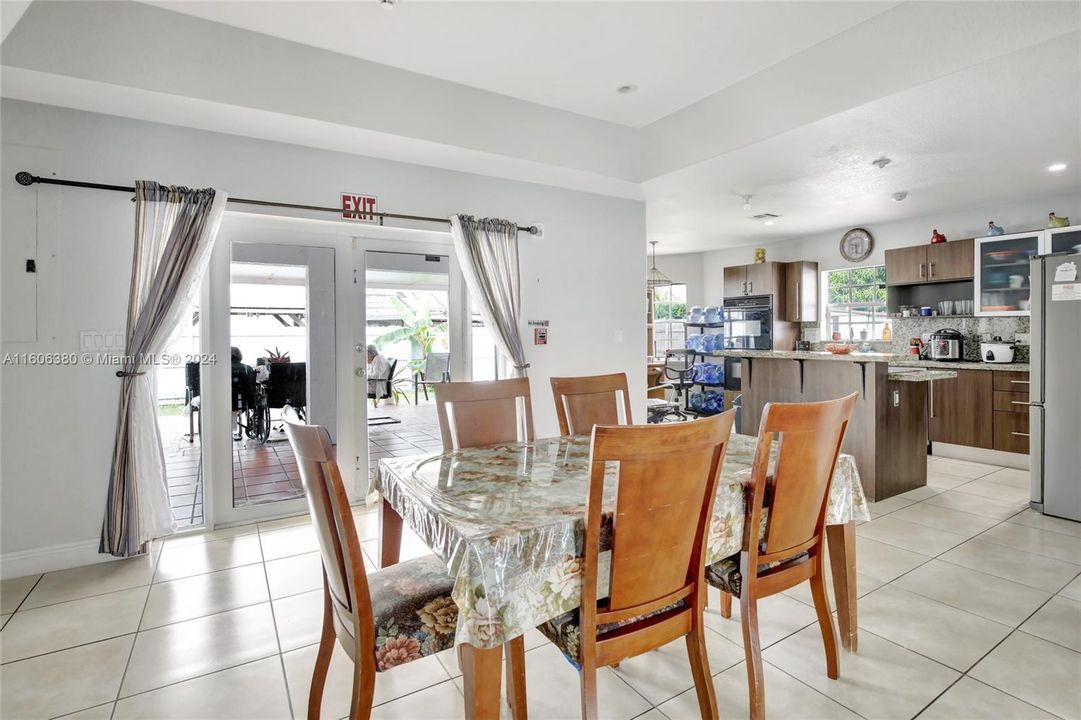 Dining room with French door leading to the terrace and open to the kitchen gives it a great flow for any gathering.