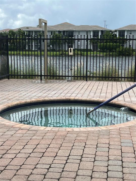 Community pool with Relaxing Hot tub that is only steps away from the front door or backdoor