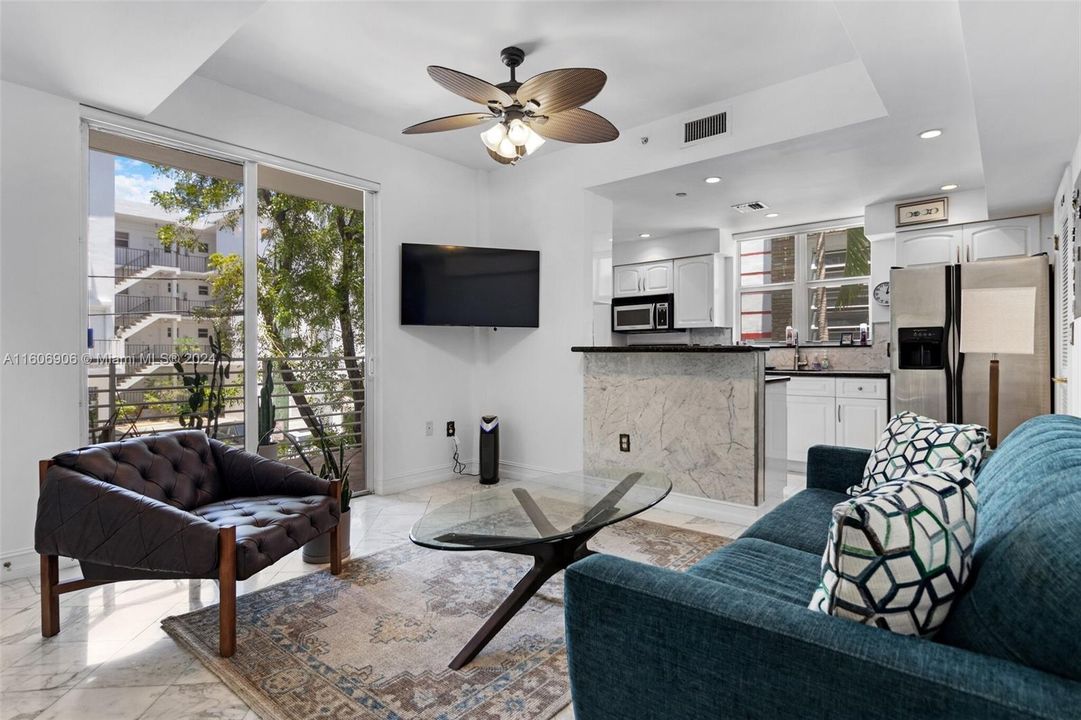 bright living room with private balcony