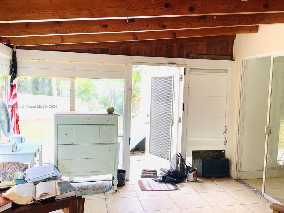 Enclosed back porch with back yard access