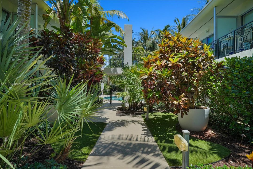 Lush peaceful gardens leading to second heated pool