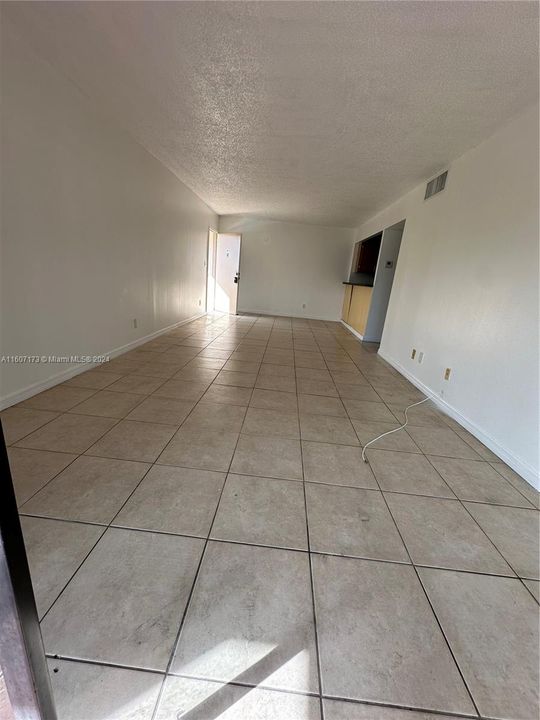 Living and dining - view from balcony towards entry and kitchen