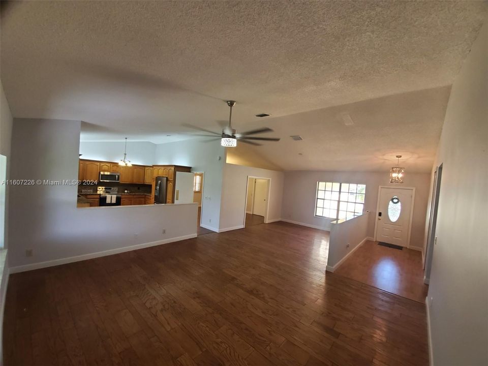 Formal Dining room or Den facing into living room area and kitchen door