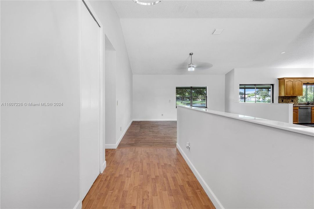 living room and great room area/kitchen to right.