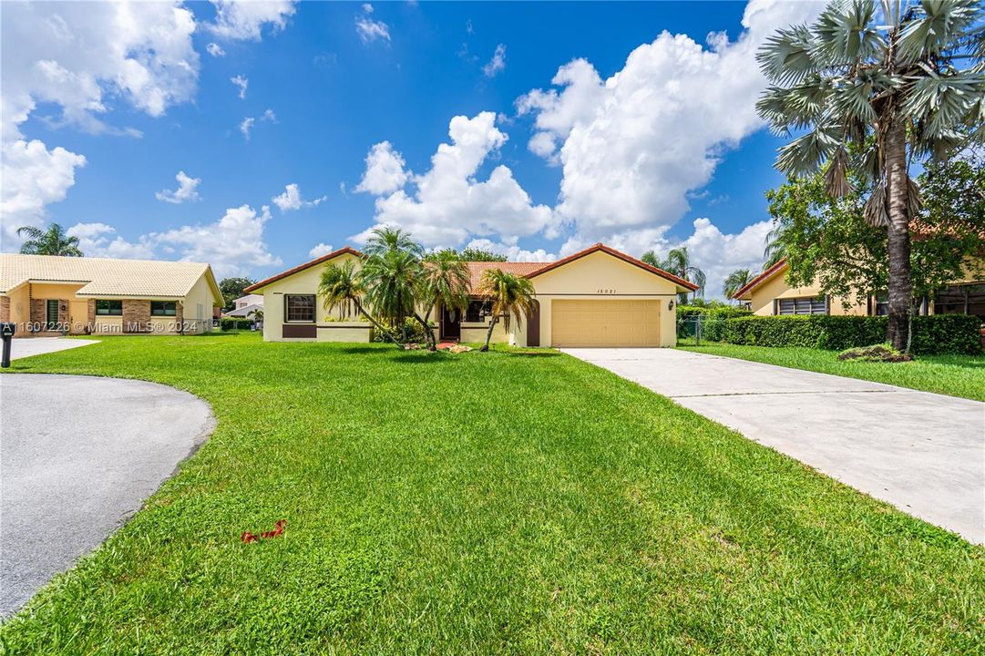 Front of house and long driveway