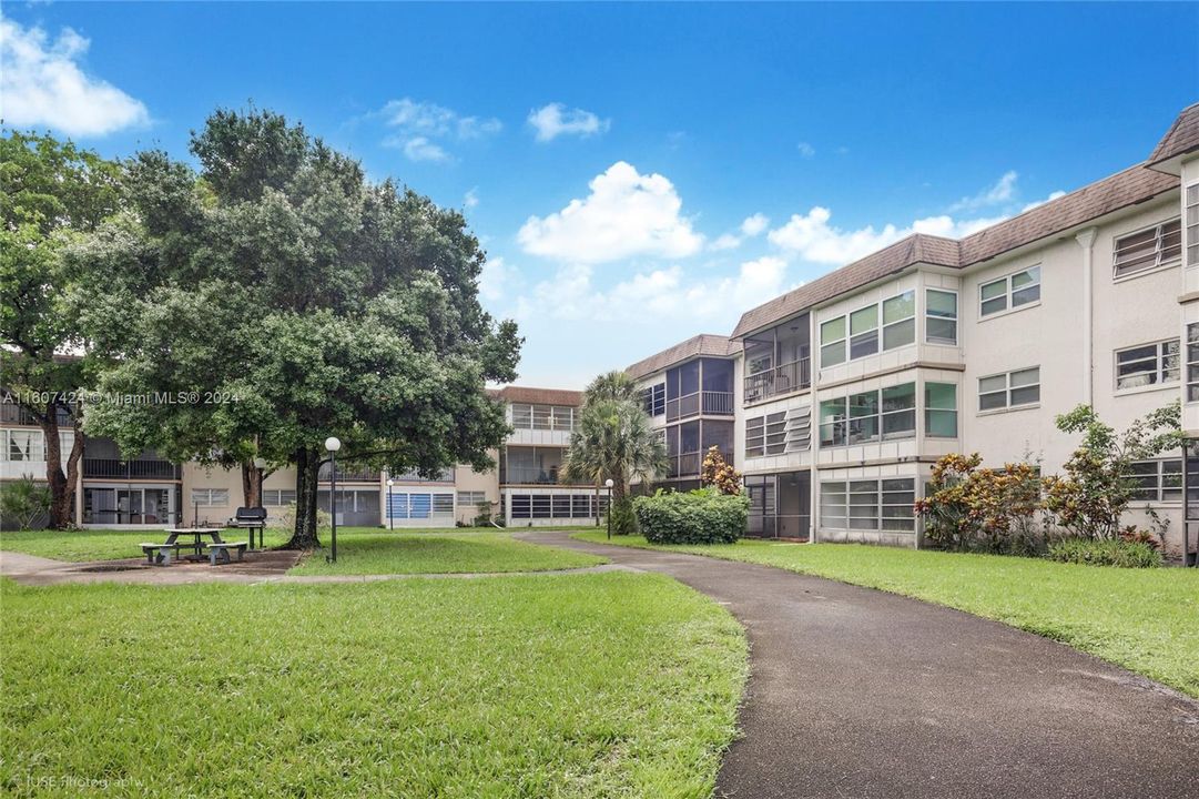 Quaint Condo Complex with Lush Greenery