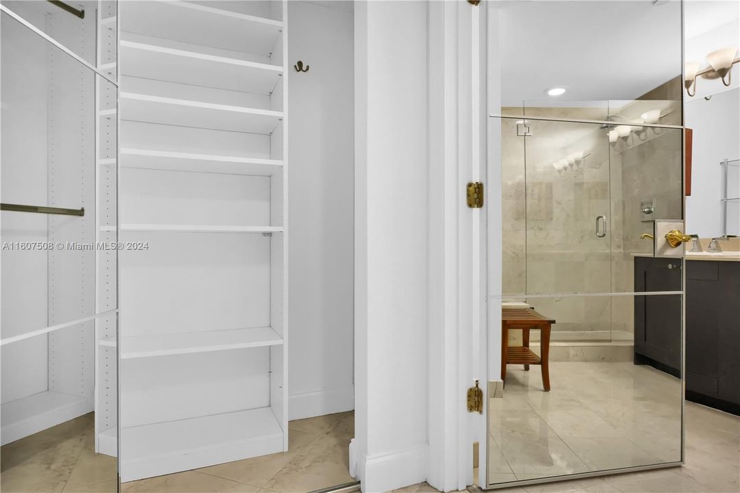 Ensuite marble bathroom with shower in Primary Bedroom