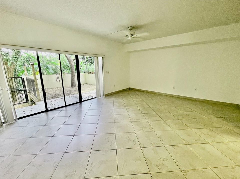 Huge, spacious and wide open Living Room with open floor plan with access to your private patio.