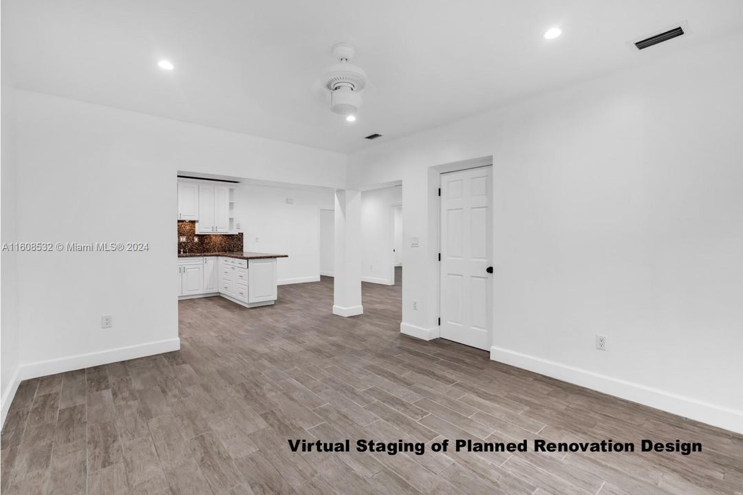 Looking towards open kitchen and dining area. Door on the right is the laundry room