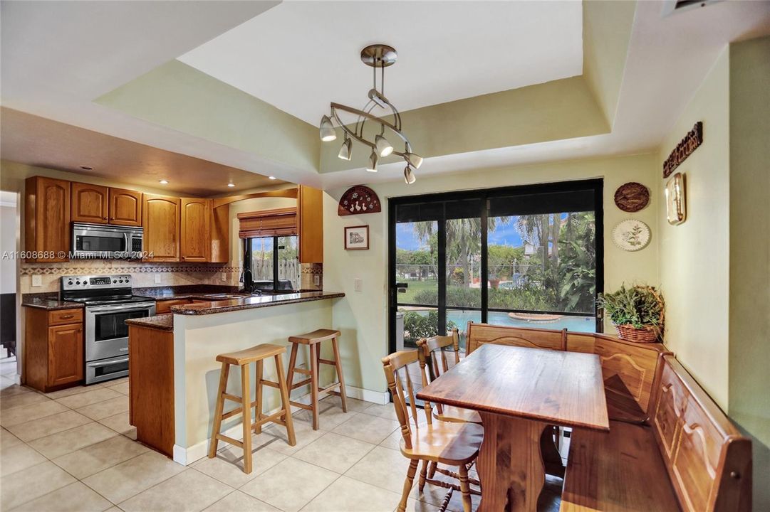 THE KITCHEN OVERLOOKS THE POOL