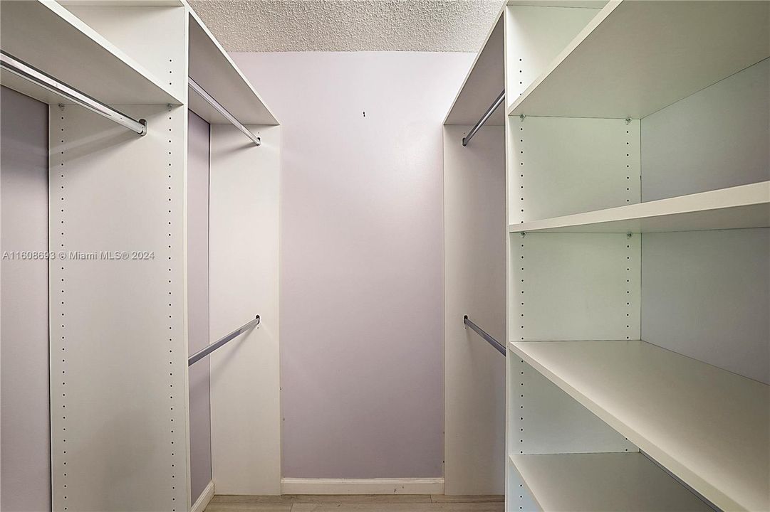 Custom built in shelving in walk-in closet