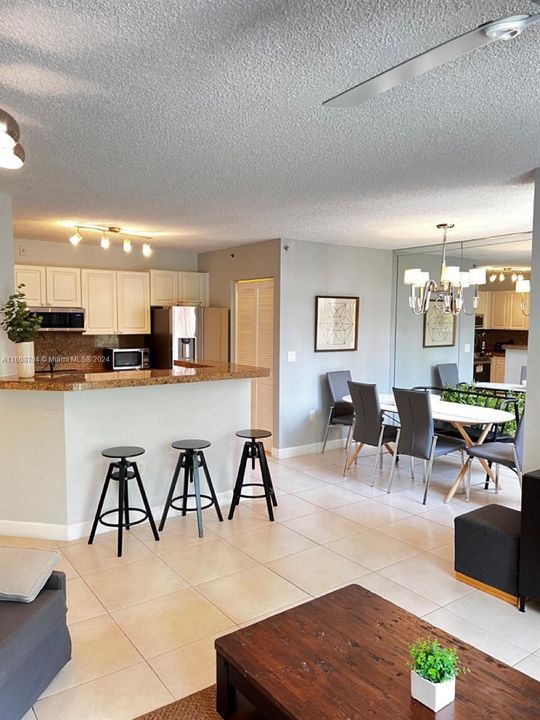 Living room looking at kitchen and dining area