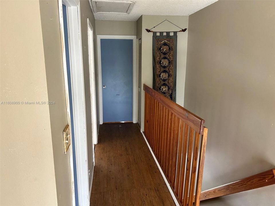 3rd floor hallway blue door is 3rd bedroom