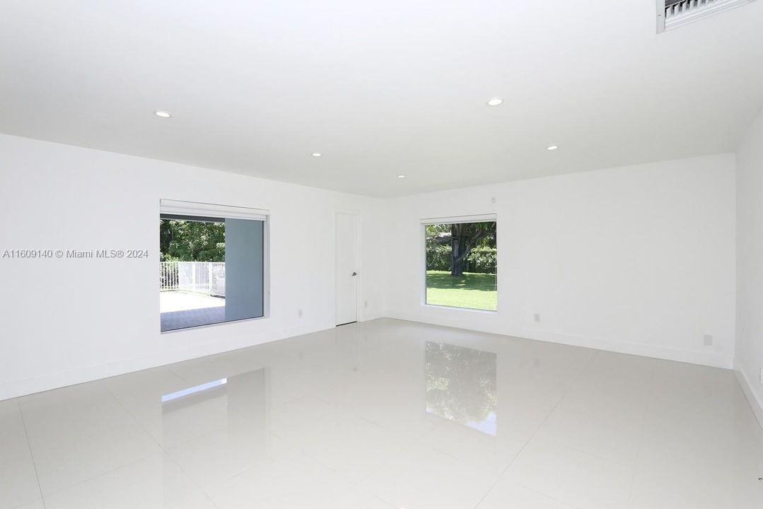 Family Room. The door to the right is the 3rd full bathroom and cabana bath