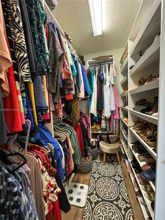 Master walk-in closet with built-in shelving