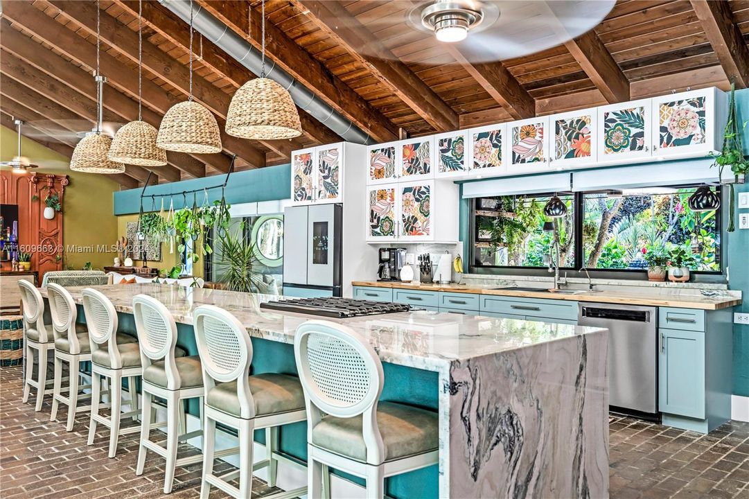 great counter space...custom hardwood and lovely veined granite, nice view of passthru with exterior bar