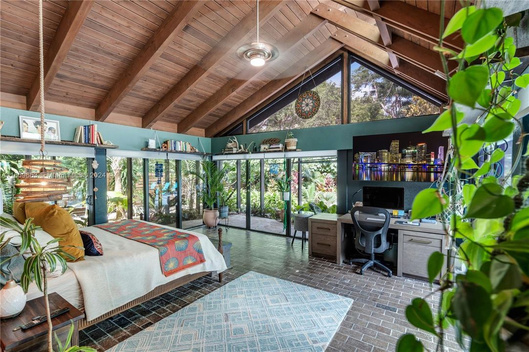 main suite on west wing ( split from guest suites by great room) with electric blinds offer privacy in this wall of glass overlooking pool /patio with private courtyard on the remainder