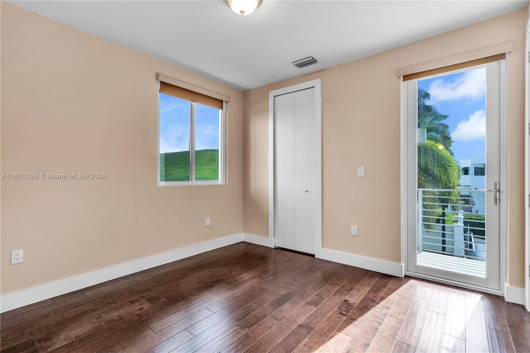 second floor bedroom with balcony