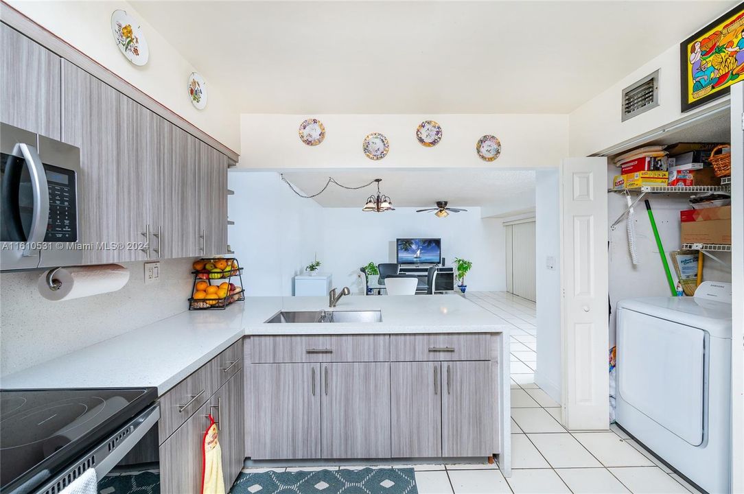 Kitchen overlooking Great Room with Waterfall peninsula and extra counter seating