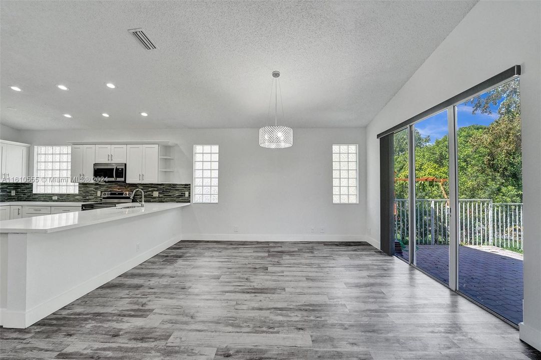 Spacious Dining area overlooking covered patio with views to the private golf course