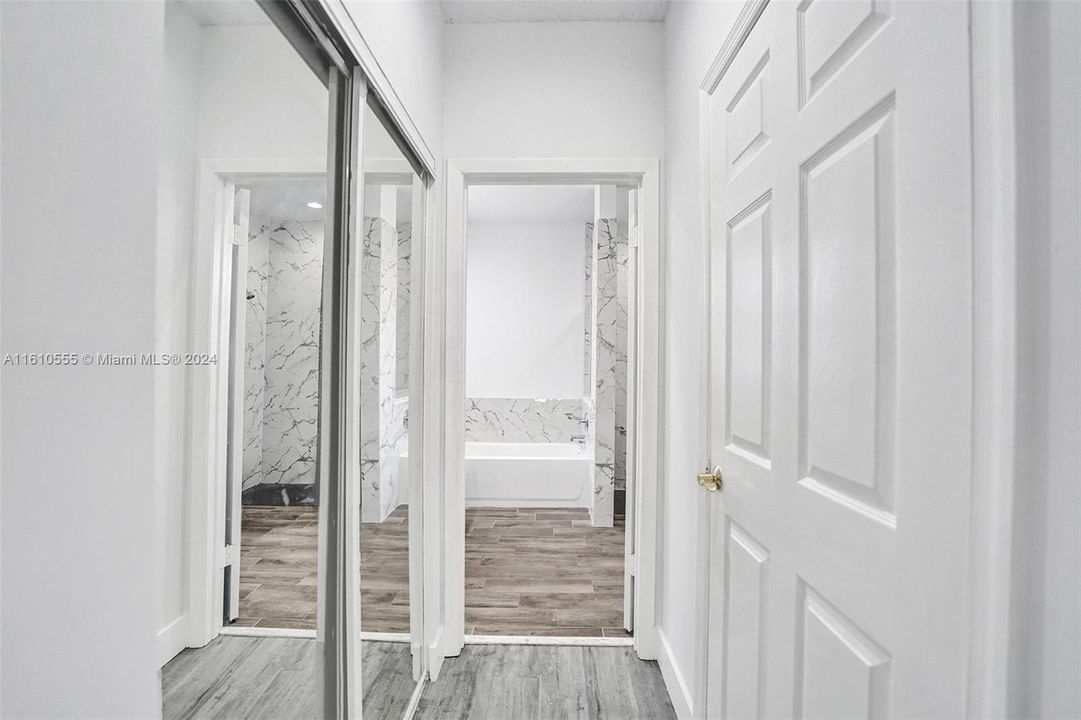 Two closets - One walk-in closet and a secondary hallway closet that connect towards the Primary Bathroom