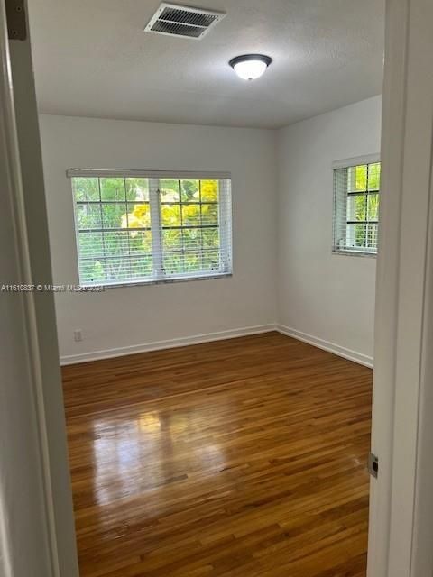 2nd bedroom with polished hardwood floors