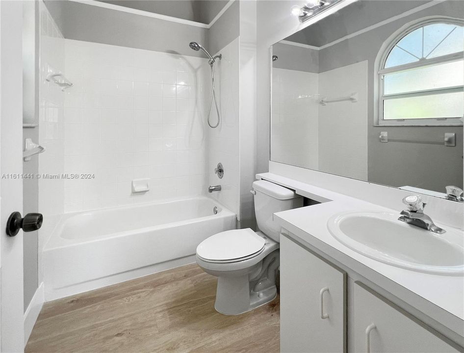 Primary bathroom ensuite with new luxury laminate flooring