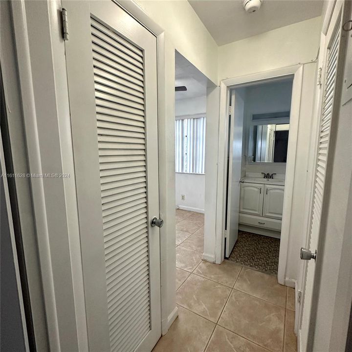 Hallway between dining room & bathroom. Pictured is the a/c closet also recently replaced