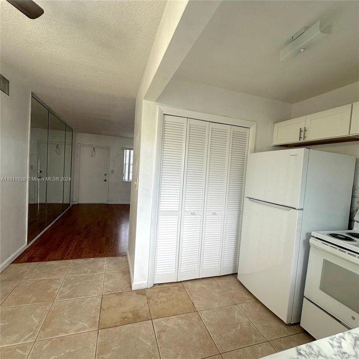 Pantry view closed with view of living room