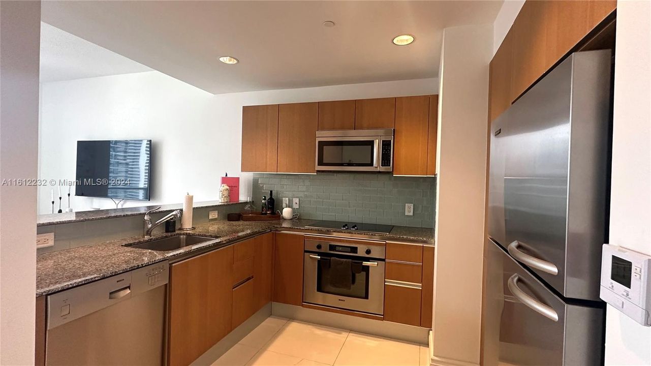 Clean kitchen with newer appliances