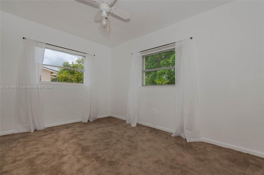 3rd bedroom with 2 windows that brighten the room.