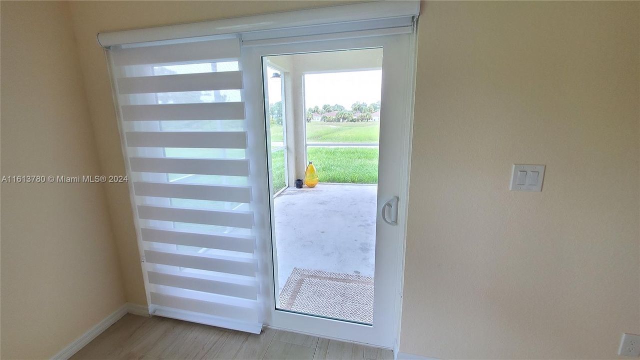 A hallway leading to the second and third bedrooms, as well as the guest bathroom.